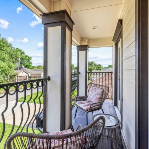 Cozy balcony with a beautiful view— perfect for enjoying a morning coffee.