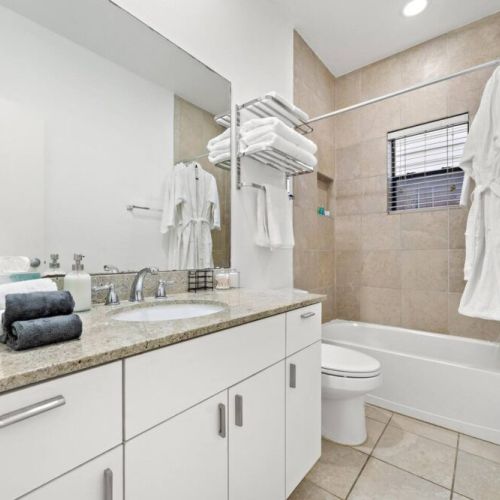 2nd full bathroom is fully stocked with all you need. White robes included.