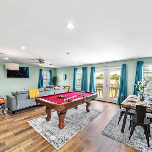 Full-size pool table and foosball table included.