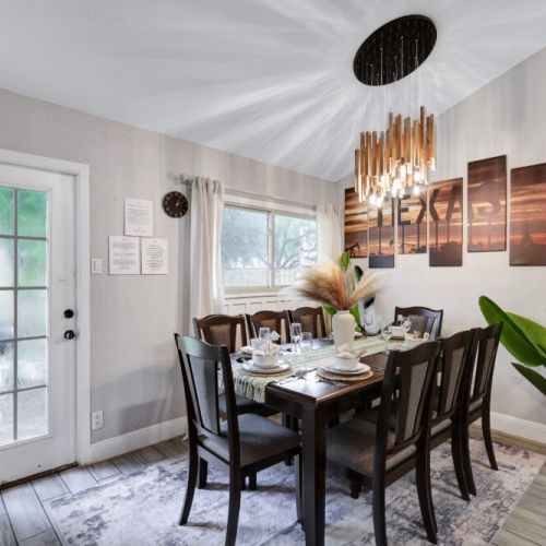 Spacious dining table that sits 8 with full tableware and silverware included.