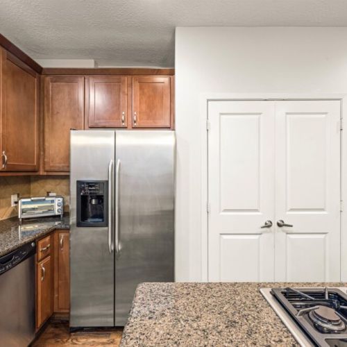 Fridge does NOT dispenses water or ice. Stainless steel appliances.