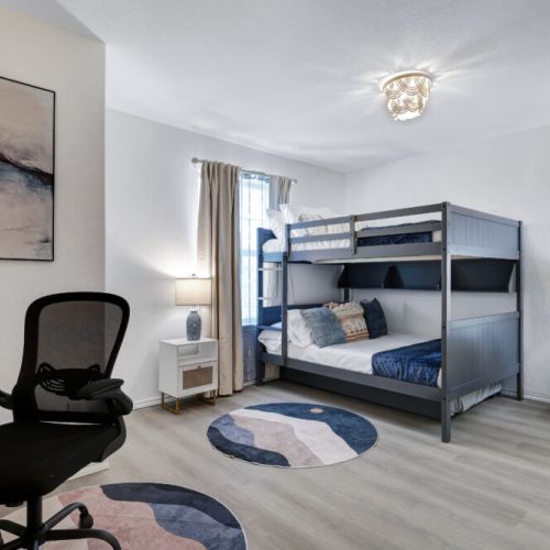 4th bedroom with 1 twin size bed and 2 full size beds (triple bunk bed).