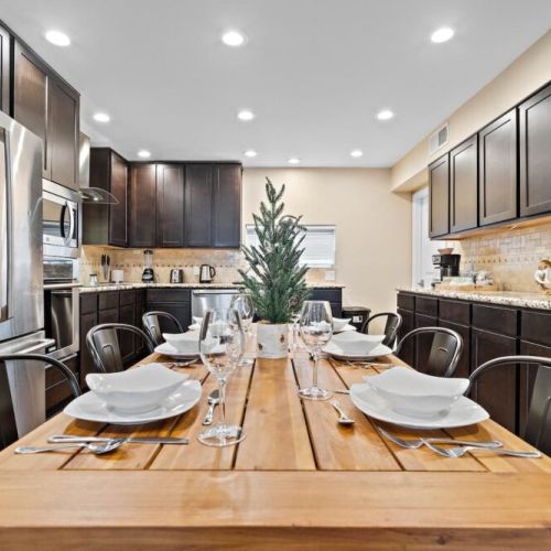 Spacious dining table that sits 6 with full tableware and silverware included.