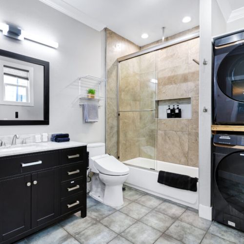 5th full bathroom is fully stocked with all you need. Additional washer/dryer