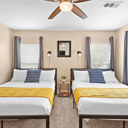 1st bedroom with two queen size beds! Super comfortable memory foam mattresses.