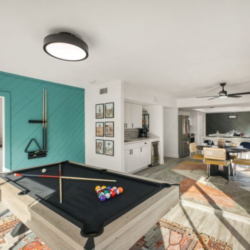 Bring out your competitive side with a game of pool in this vibrant game room.