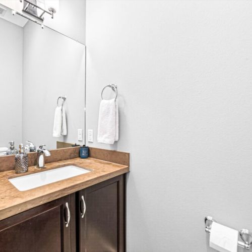 Half bath next to the living room for maximum convenience.