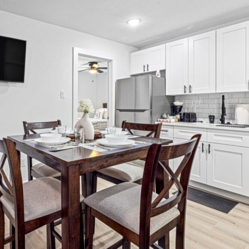 Charming dining table that sits 4 with full tableware and silverware included.