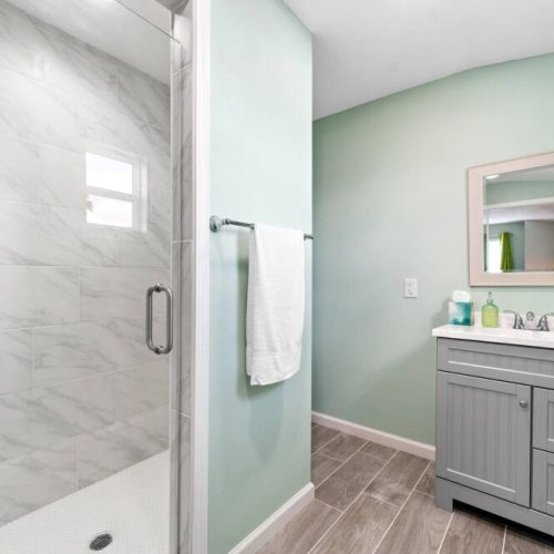 Primary bathroom with makeup pads, and q-tips.