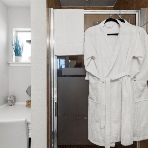 White robes and towels included.