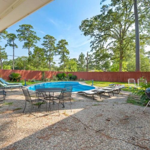 Grill, table/chairs, and lounge pool chairs.