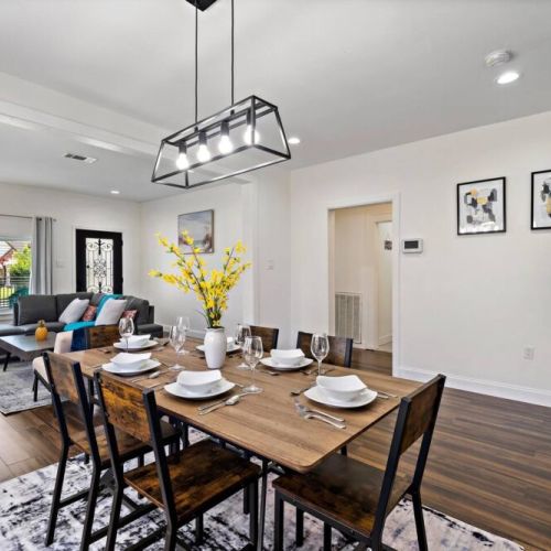 Spacious dining table that sits 6 with full tableware and silverware included.