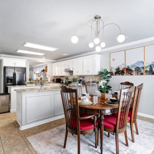 Spacious dining table that sits 6 with full tableware and silverware included.