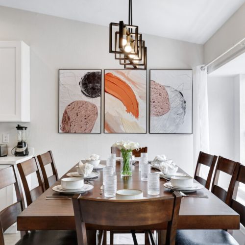 Spacious dining table that sits 8 with full tableware and silverware included.
