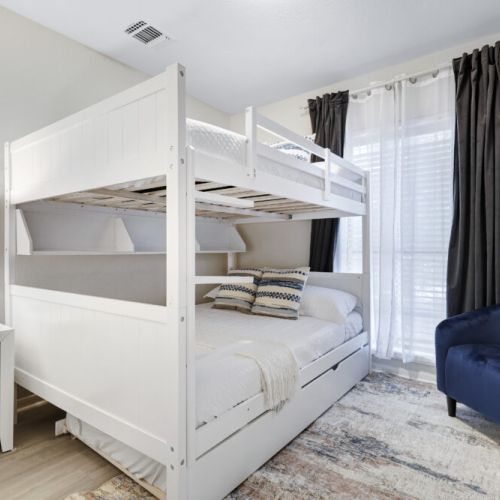 4th bedroom with 1 twin size bed and 2 full size beds (triple bunk bed).