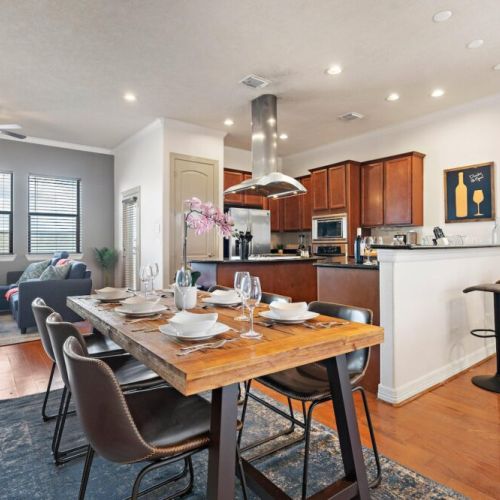 Spacious dining table that sits 6 with full tableware and silverware included.
