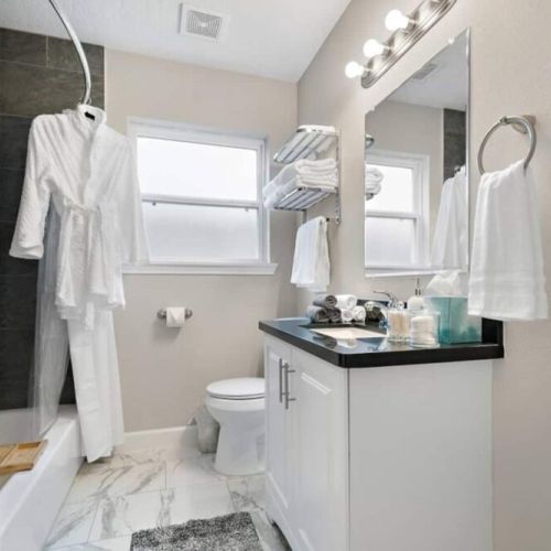 1st bathroom  is fully stocked with all you need. Makeup pads, q-tips, and white robes included.