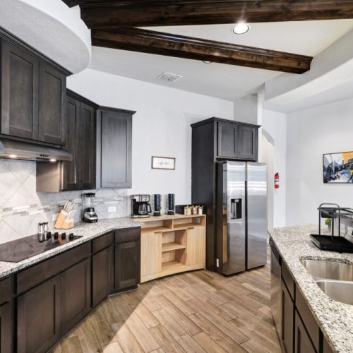 Fully equipped kitchen with high quality granite countertops.