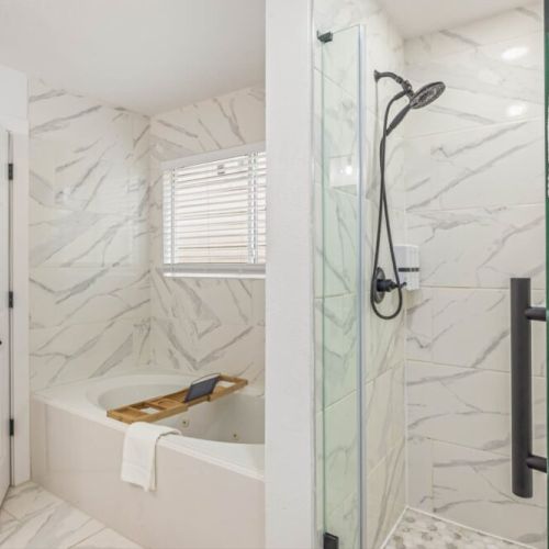 Unwind with a soothing standalone tub and spacious walk-in shower for ultimate comfort.