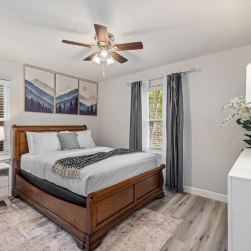 3rd bedroom with queen size bed. We also include a dresser and a mirror.