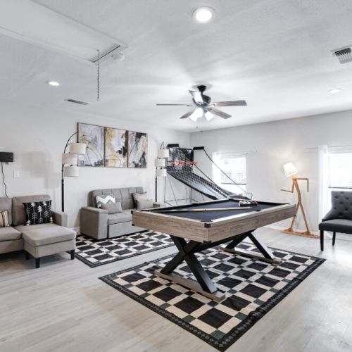 Game room with sectional sofa.
