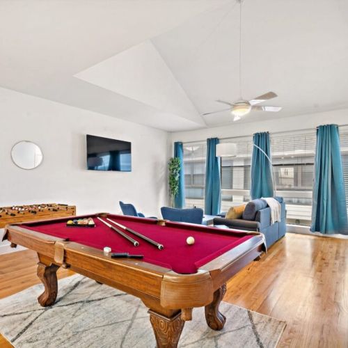 Full-size pool table and foosball table included.