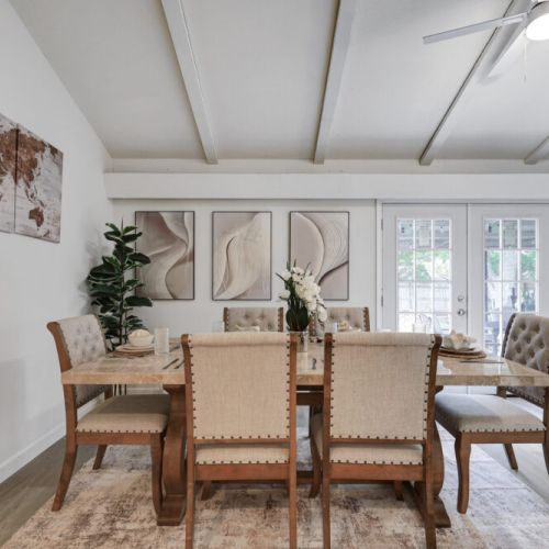 Spacious dining table that sits 6 with full tableware and silverware included.