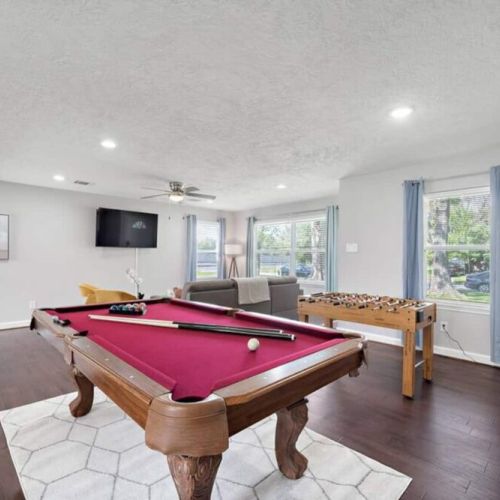 Full-size pool table and foosball table included.