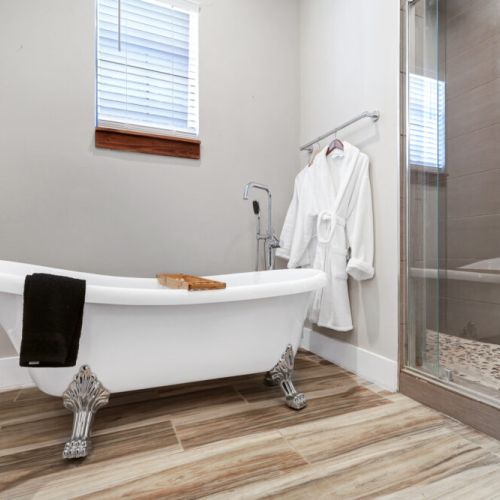 Pour yourself a glass of wine & relax. White robes included.