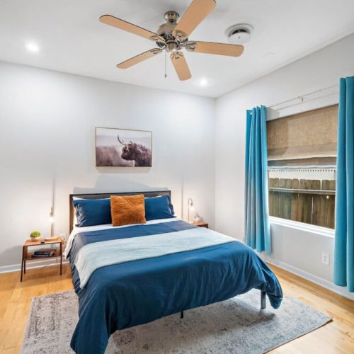 3rd bedroom with queen size bed and direct access to the back patio.