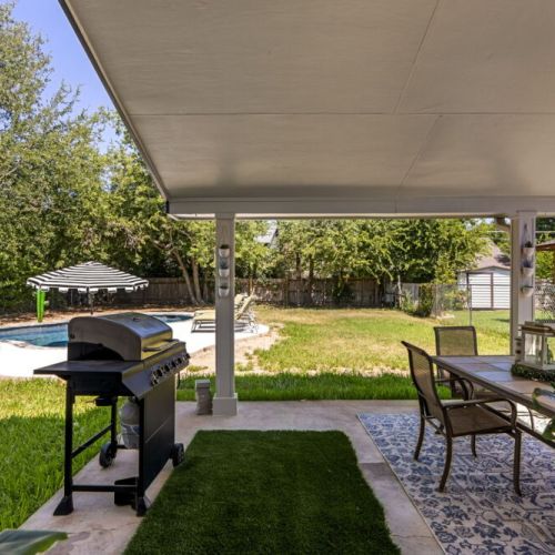 Not just a pool and BBQ, but  also an expansive backyard where your furry friends can play until they drop!