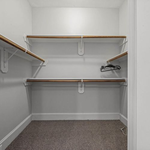Fully equipped 2nd walk-in primary closet.