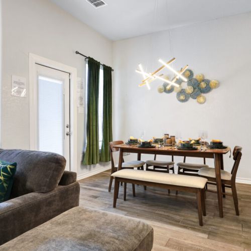 Spacious dining table that sits 6 with full tableware and silverware included.