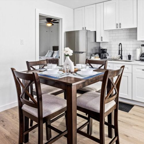 Charming dining table that sits 4 with full tableware and silverware included.