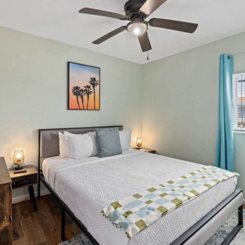 6th bedroom with queen size bed from the house at the back.