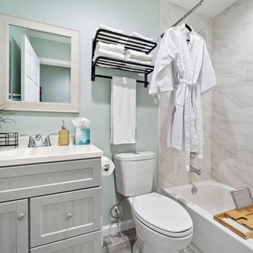 2nd full bathroom is fully stocked with all you need. White robes included.