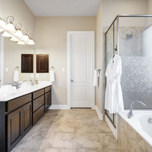 Primary bathroom is fully stocked with all you need. Makeup pads and q-tips included.
