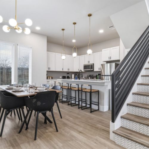 Spacious dining table that sits 6 with full tableware and silverware included.