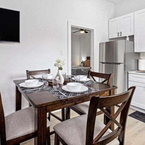 Charming dining table that sits 4 with full tableware and silverware included.