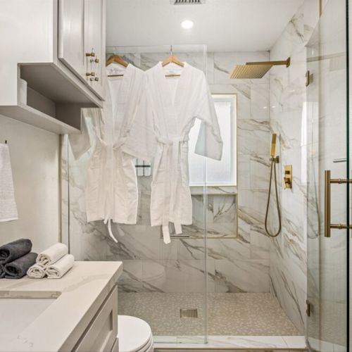 White robes and towels included.