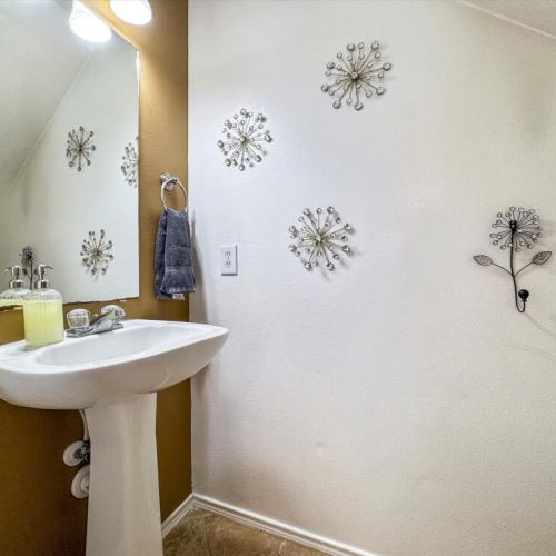 Half bath in the game room for maximum convenience.