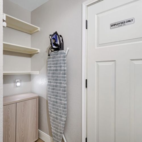 Iron and ironing board included.