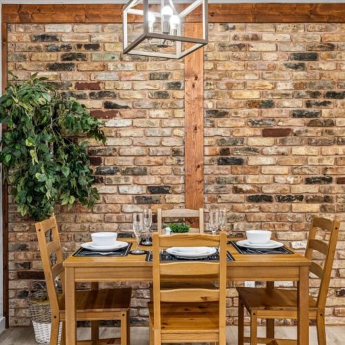Charming dining table that sits 4 with full tableware and silverware included.