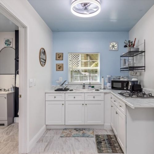 Coffee bar included with a drip coffee machine with complimentary coffee, decaf, tea, sugar, cream, and sweetener included