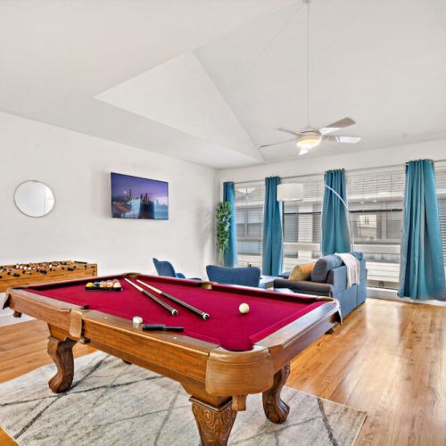 Full-size pool table and foosball table included.