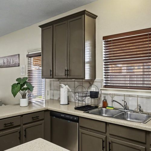 A homely kitchen filled with natural light and everyday comforts.