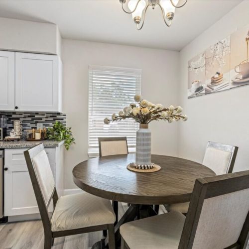 Charming 2nd dining area that sits 4 and is conveniently close to the kitchen.