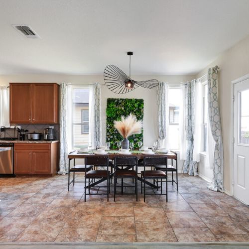 Spacious dining table that sits 8 with full tableware and silverware included.