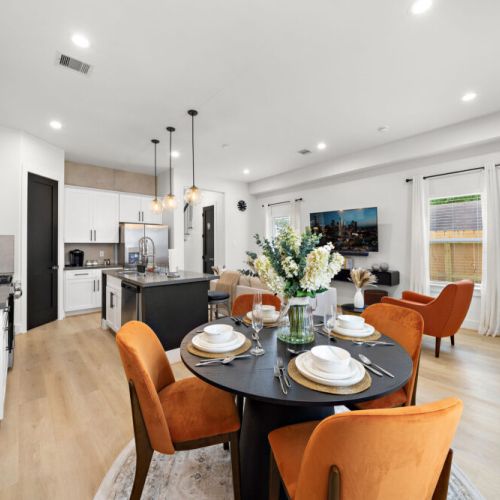 Spacious dining table that sits 4 with full tableware and silverware included.