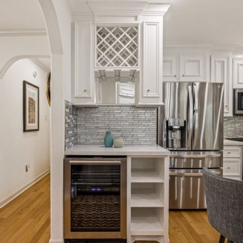 Compact wine fridge included to keep your favorites perfectly chilled.